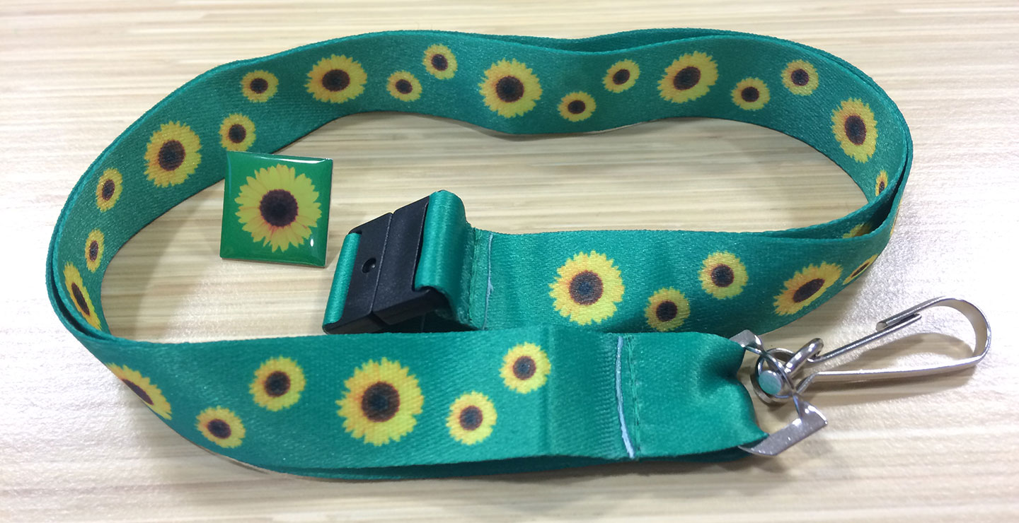 A lanyard printed with a yellow sunflower, designed to be worn by people with hidden disabilities.